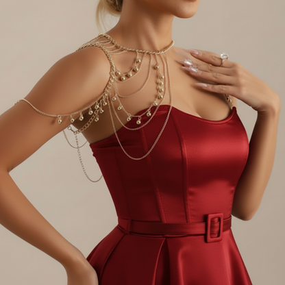 Layered shoulder drape worn over one shoulder