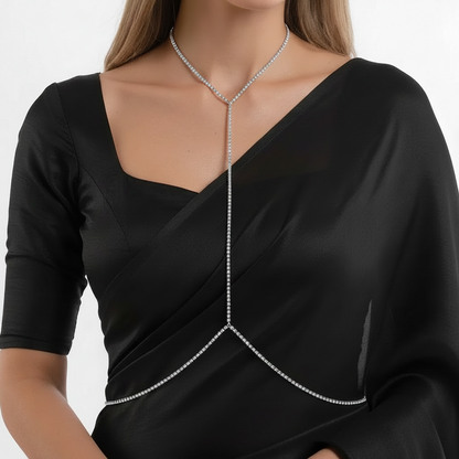 Silver-tone crystal line body chain worn with a corset top