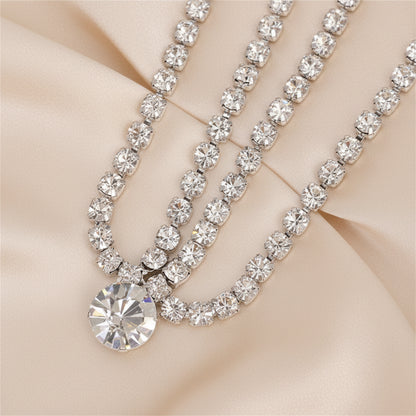 Crystal teardrop body chain in gold-tone