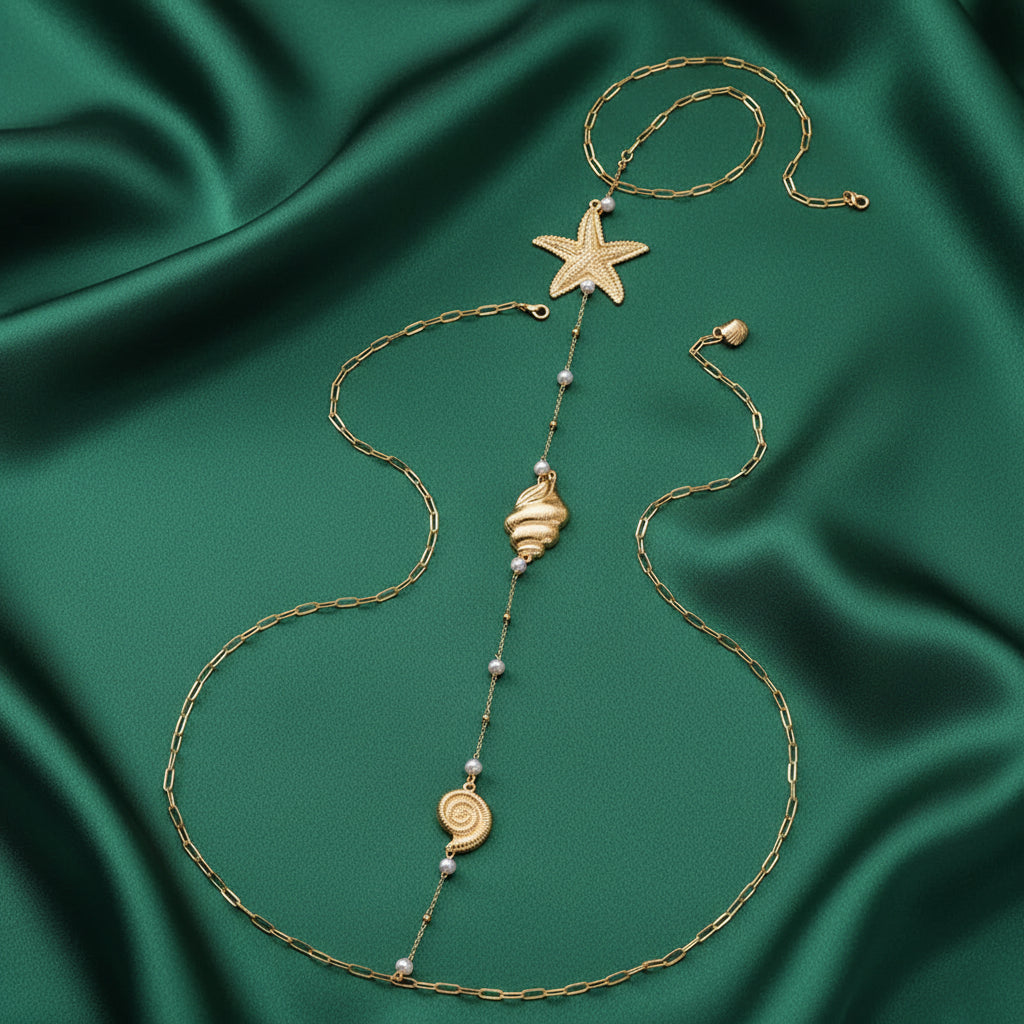 Ocean Treasures detail, starfish and seashell charms in gold-tone
