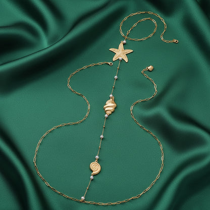 Ocean Treasures detail, starfish and seashell charms in gold-tone