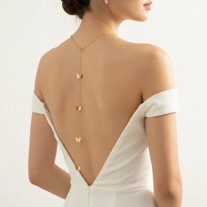 Butterfly back chain worn down the spine with an open-back blouse