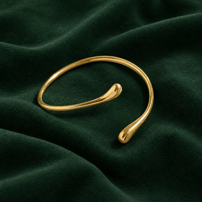 Fluid sculptural arm cuff in silver-tone by ReevaTara