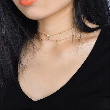 Celeste Glow dual-layer choker with a crystal-dotted link