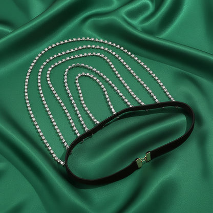 Crystal-set chains draping along the upper thigh
