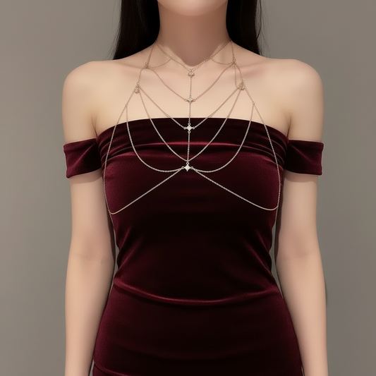 Silver-tone crystal harness worn across the shoulders