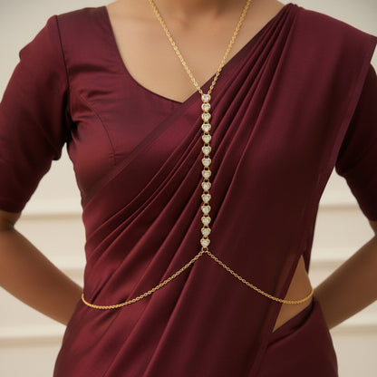 Stone drop body chain worn with a deep neckline