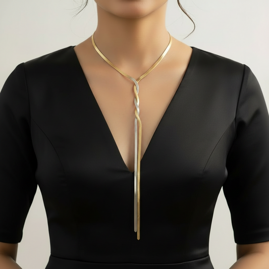 Dual-tone snake chain worn with a plunging neckline